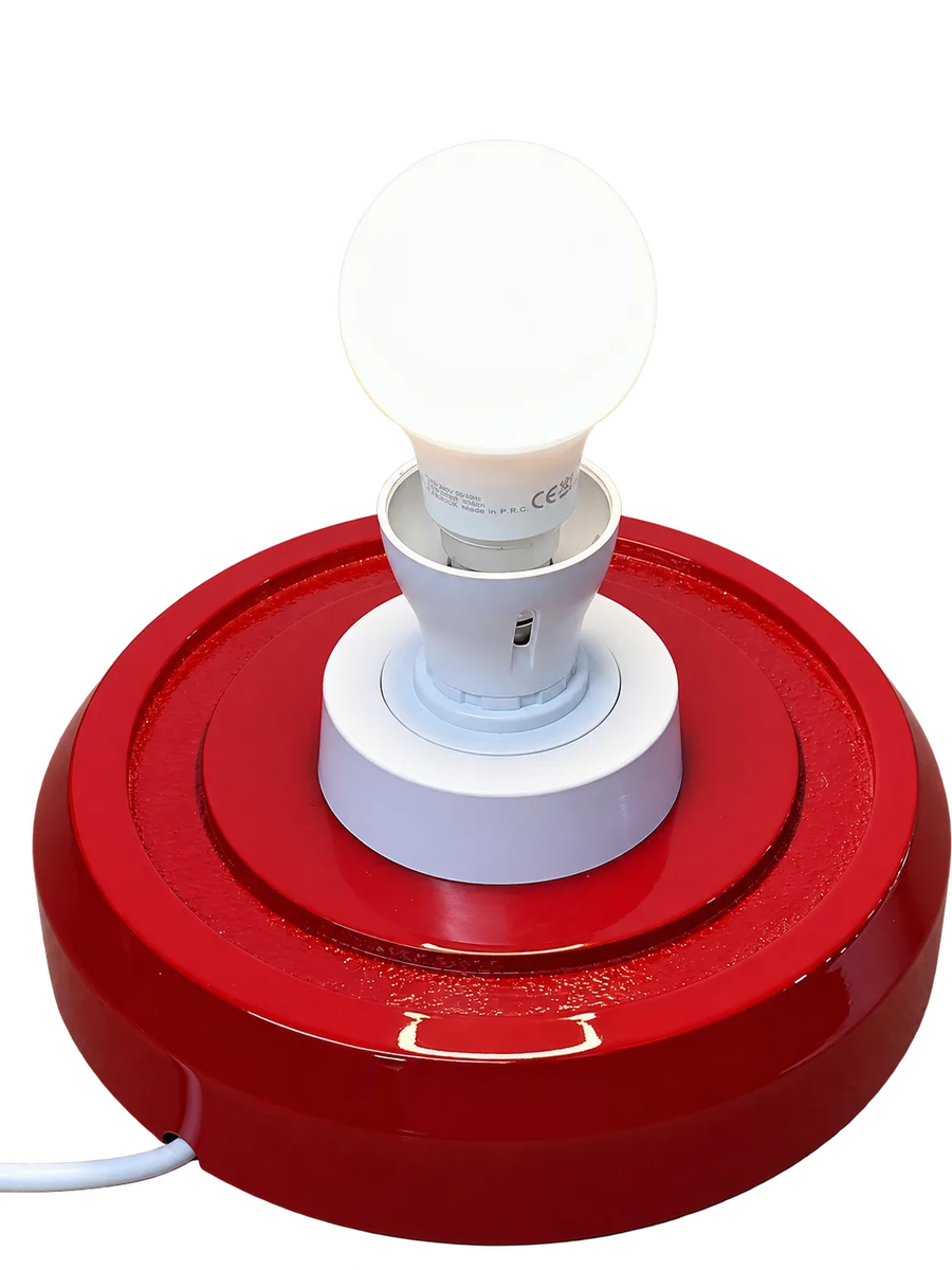 Red petrol pump globe base with bulb lit